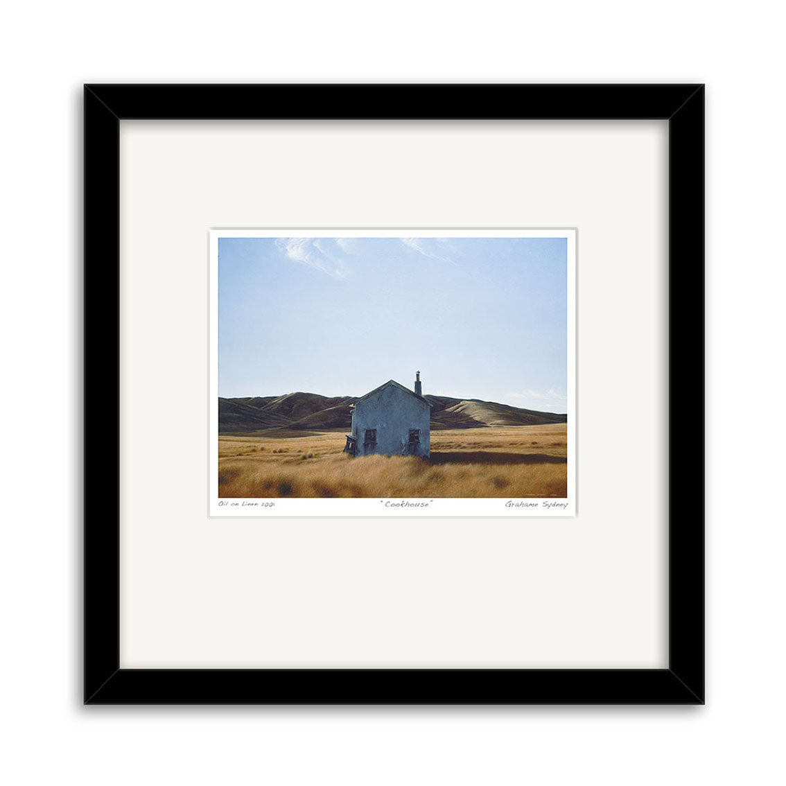 The Grahame Sydney - Family Trees, Gimmerburn Road Small Art Print depicts an isolated white building in tall grass with rolling hills and a blue sky, evoking the iconic landscapes captured by New Zealand artist Grahame Sydney.