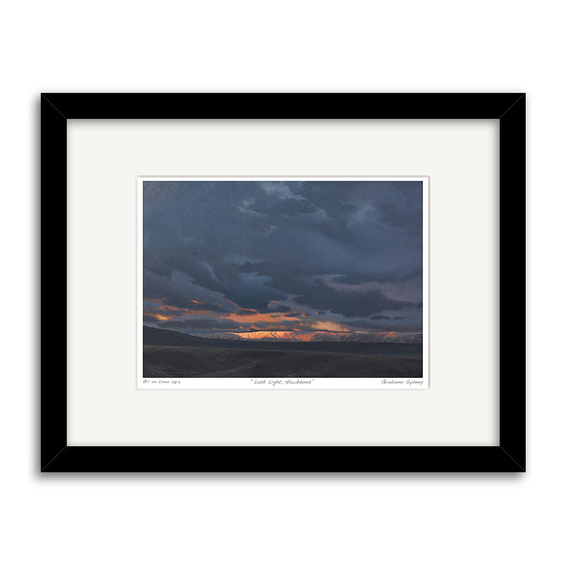 The Grahame Sydney - Last Light Hawkduns Small Art Print features a dramatic sky with dark clouds over distant mountains and a vibrant orange sunset on the horizon, making it an ideal addition to any art collection.