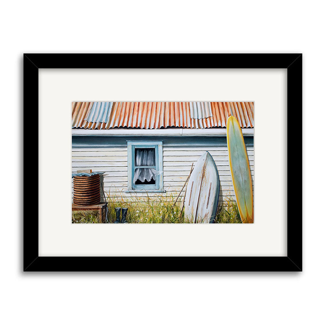 The Back of the Bach Small Art Print by New Zealand artist Graham Young depicts a weathered house with a rusted roof, lace-curtained window, surfboards, and tall grass—a distinctive addition to any art collection.