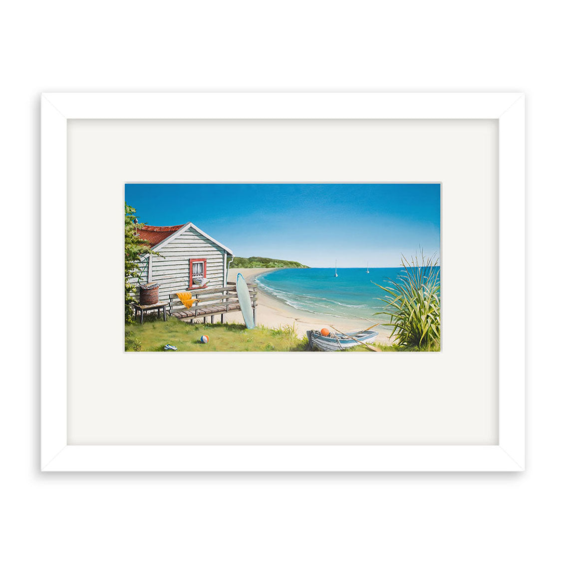 Graham Young - Bach by the Beach Small Art Print: A vibrant coastal scene with a beach hut, surfboard, sandy shore, grass, blue sky and water, distant land, and sailboats. Available as prints.