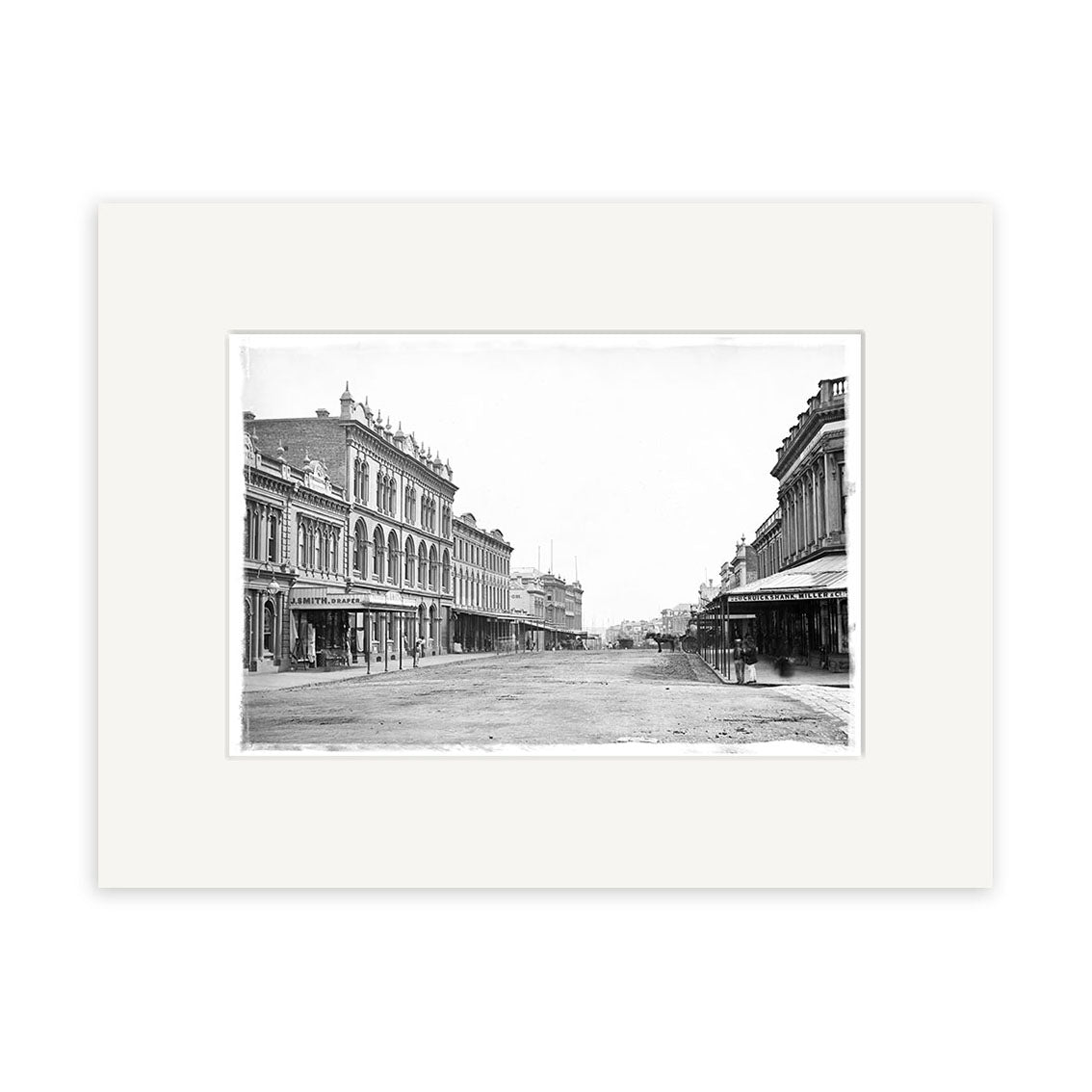 Black and white photo, Queen St 1880 - HI040, shows a wide empty street in New Zealand lined with multi-story buildings featuring awnings and ornate details. This historical photographic print is archival quality for collectors and enthusiasts.