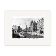 Archival quality black and white photographic print, Custom St 1910 - HI044, features a New Zealand city street scene from the early 1900s with people, horse-drawn carriages, early automobiles, and ornate buildings with a clock tower.