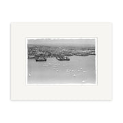 A black-and-white historical print, Anniversary Regatta 1950 - HI047, depicts a New Zealand harbor with buildings, docks, ships, and many small sailboats in the foreground as the city stretches into the background.