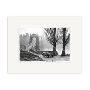 A vintage black-and-white photo titled Otago Central Bridge 1930 - HI098 shows an old car by a road near tall trees and the stone suspension bridge over water in New Zealand, with dense foliage and mist in the background.