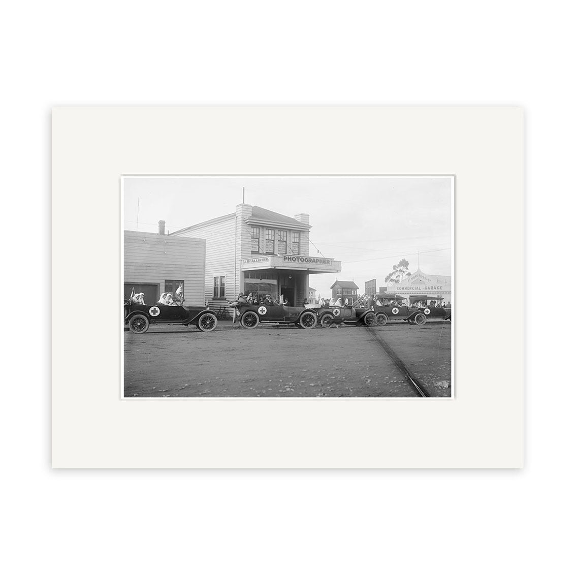 Historic black and white photo of early 20th-century cars by a two-story Photographer building. Broadway Stratford 1919 - HI139 historic New Zealand print available on archival quality matte paper.