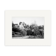 Black-and-white archival print titled Girls College 1910 - HI156 shows a large house or institutional building in Remuera, New Zealand, surrounded by trees and wooden fence; handwritten Girls College, Remuera N.Z.
