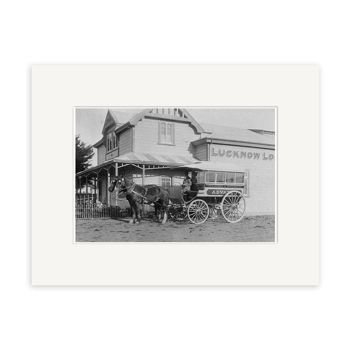 The Lucknow Lodge 1900 - HI167 is a black-and-white historical photo print showing a horse-drawn carriage and man in front of the Lucknow Lodge in New Zealand, capturing an archival quality scene from 1900.