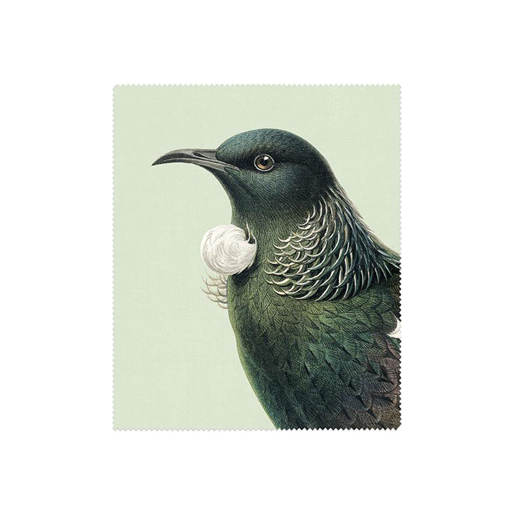 Illustration from the Set of 3 Hushed Collection Lens Cloths: features a bird with dark green feathers, iridescent neck, and white curled throat feathers on a pale green background. Cropped to highlight its head and upper body.