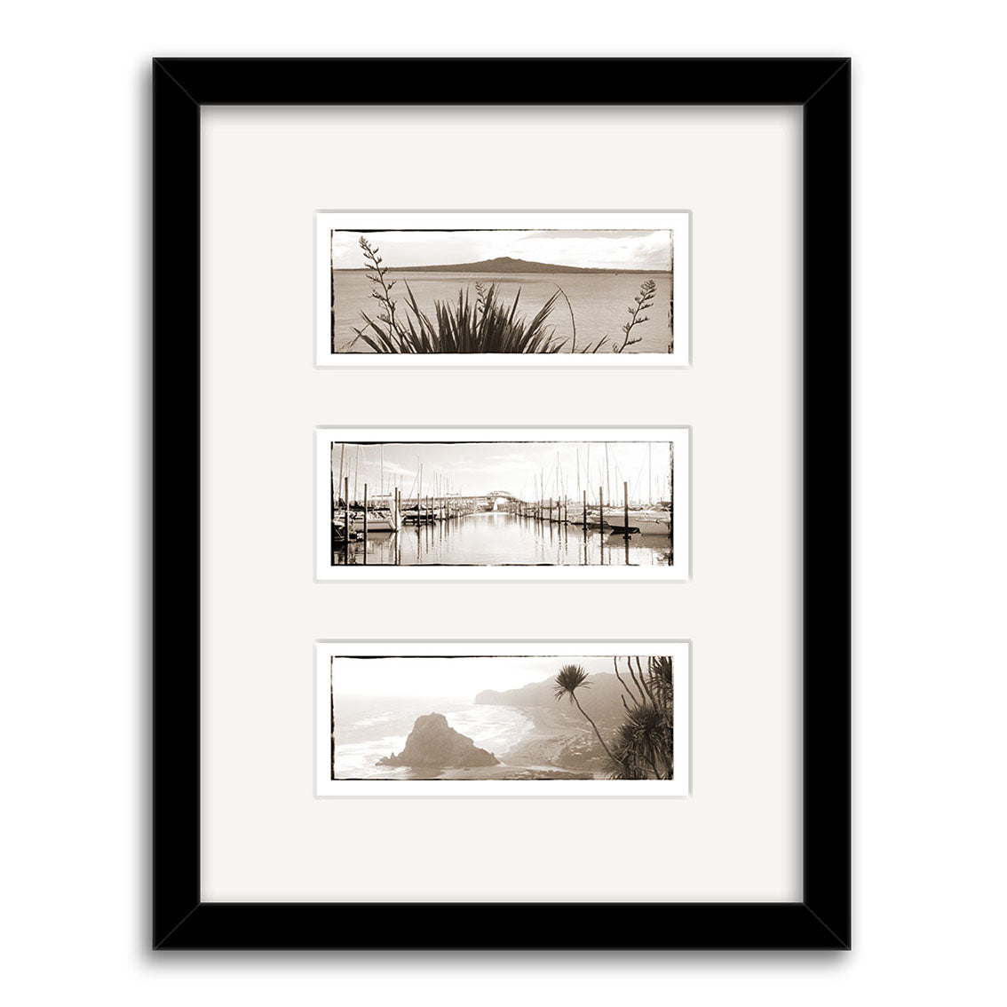 The Auckland Triptych - RP004 is a black-framed display of three archival sepia New Zealand coastal prints in a vertical layout, separated by white matting, featuring water, boats, and plant scenes.