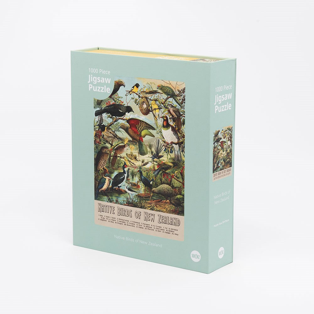 The NZ Native Bird Jigsaw Puzzle Box is a 1000-piece puzzle featuring an illustrated image of New Zealand’s native birds. The light green box displays the title “Native Birds of New Zealand” and showcases the country’s rich birdlife.