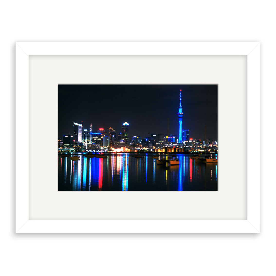 Auckland City by Night - RP007: Framed photographic print of Aucklands illuminated skyline and blue-lit tower reflected on water, printed on archival-quality matte paper to ensure lasting vibrancy.