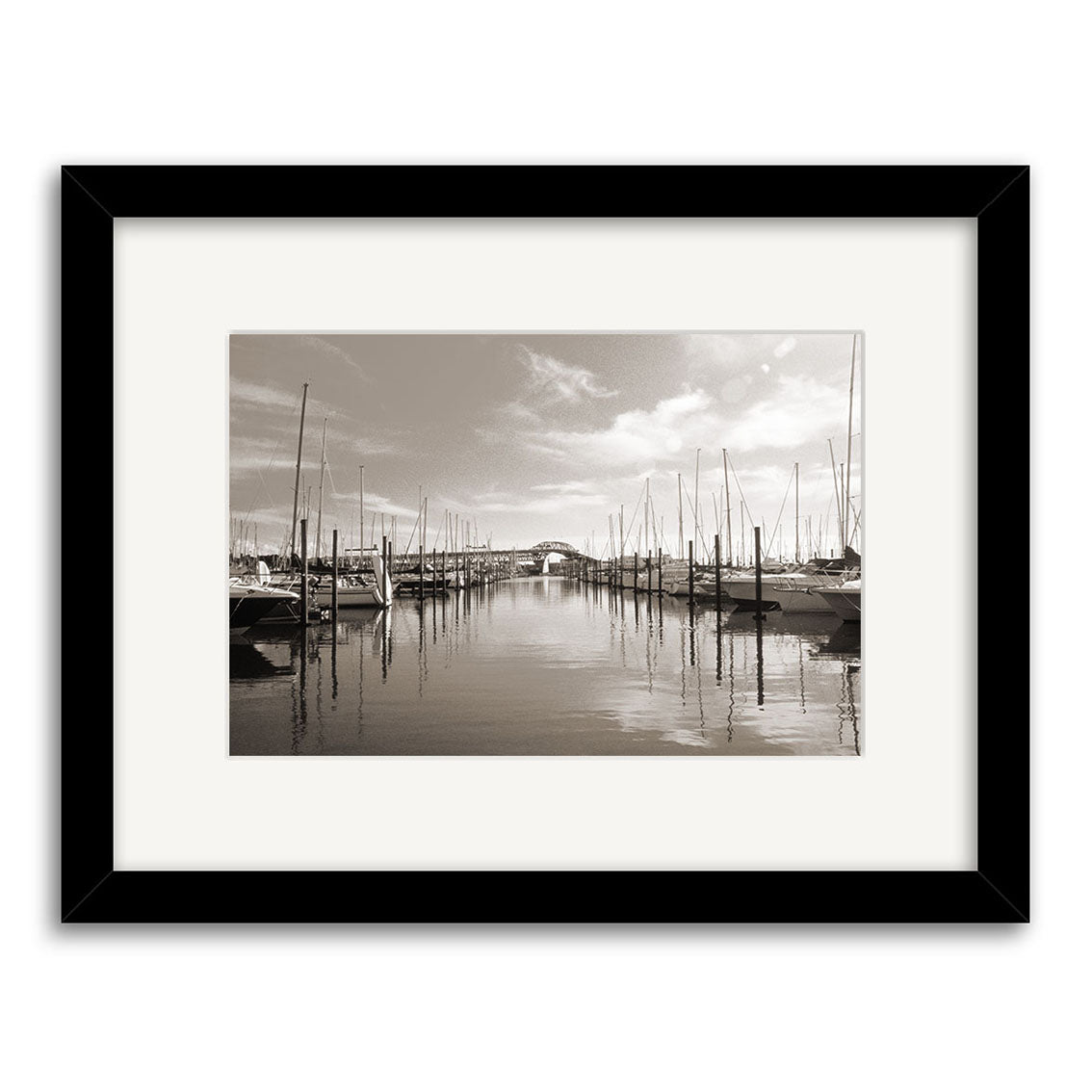 Westhaven Marina - RP020: Black-and-white photo of a New Zealand marina with calm water, sailboats docked on both sides, and masts reflected in the water. Photographic print on archival matte paper, framed with white mat and black frame.