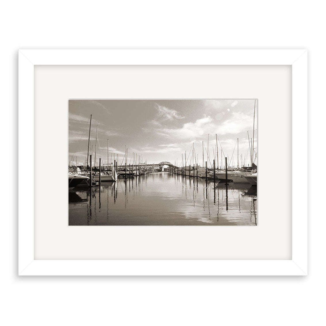 Westhaven Marina - RP020: A black-and-white photo of a New Zealand marina with sailboats and their reflections. This photographic print comes beautifully framed with a white mat and border.