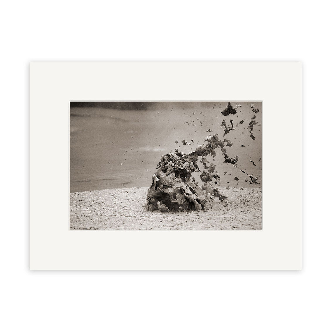 Mud Pool, Rotorua - RP036 captures a black and white burst of mud erupting skyward in New Zealand. This striking photo is mounted on a white mat and offered as archival quality matte paper photographic prints.