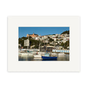 Oriental Bay Boats - RP104: Stunning photographic print featuring a marina with sailboats and yachts in the foreground and a hillside town with white buildings and a prominent reddish-brown building in the background.