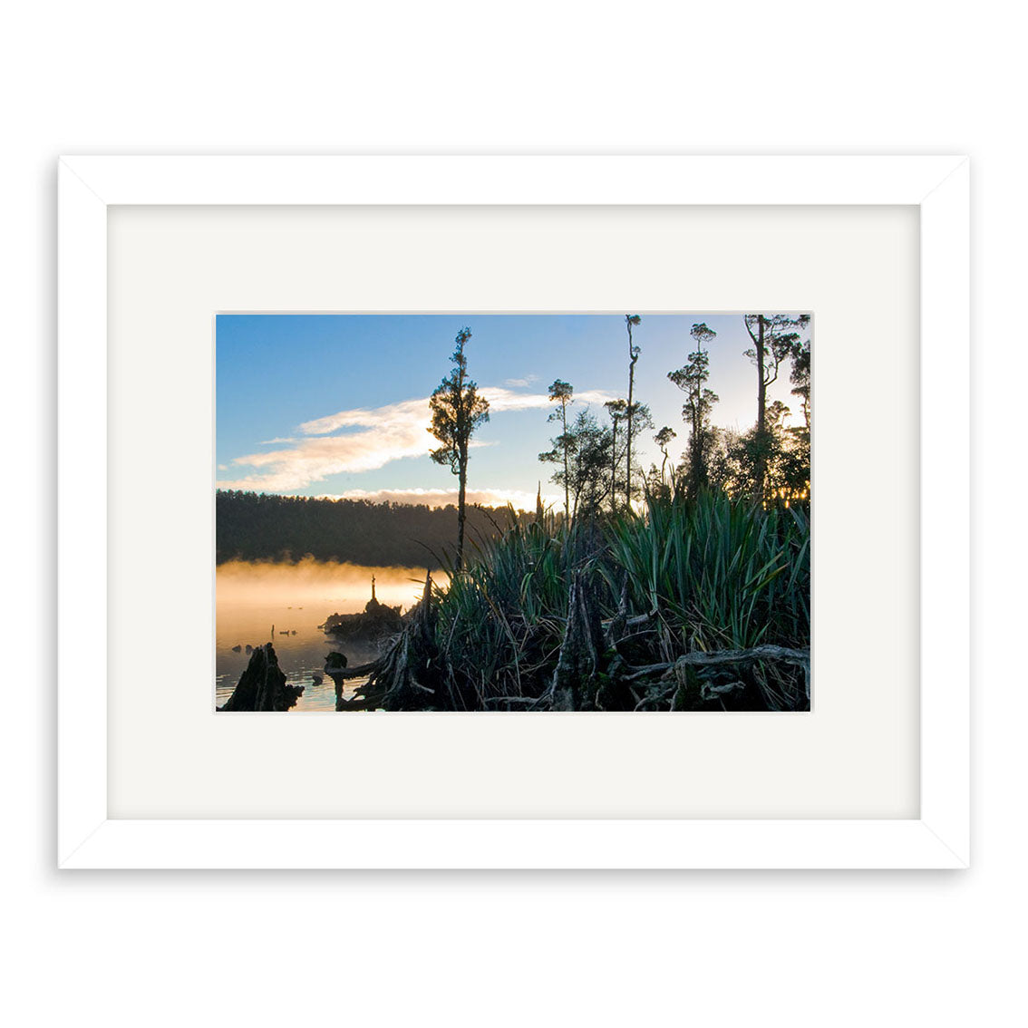 “Lake Wahapo - RP182: Framed photo print of tall grasses, misty water, and tree silhouettes by a calm New Zealand lake at sunrise or sunset, printed on archival matte paper.”.