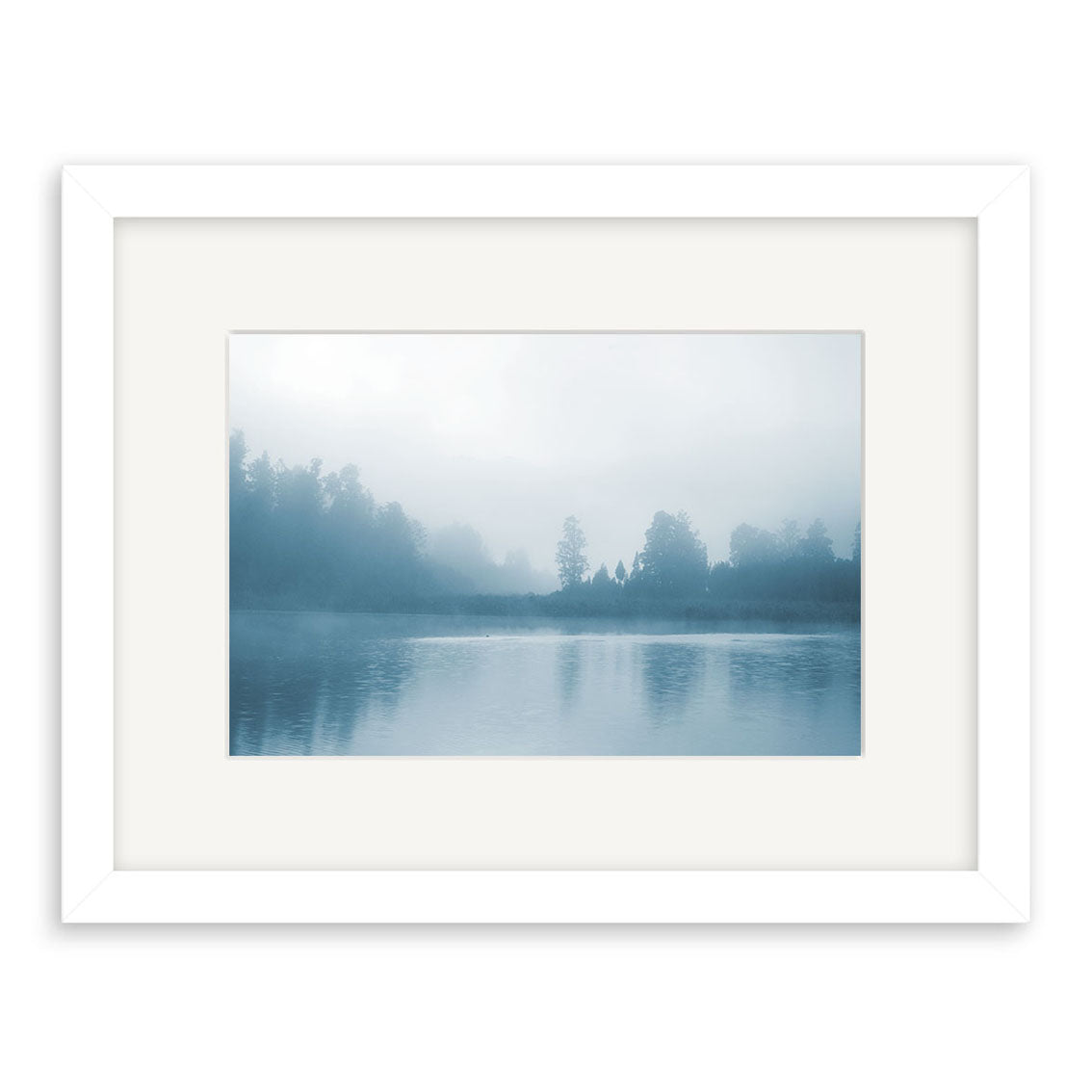 The Misty Lake Matheson - RP186 by Reuben Price is a framed New Zealand photographic print featuring a calm lake in cool blue tones, printed on archival matte paper with a white frame and wide mat.