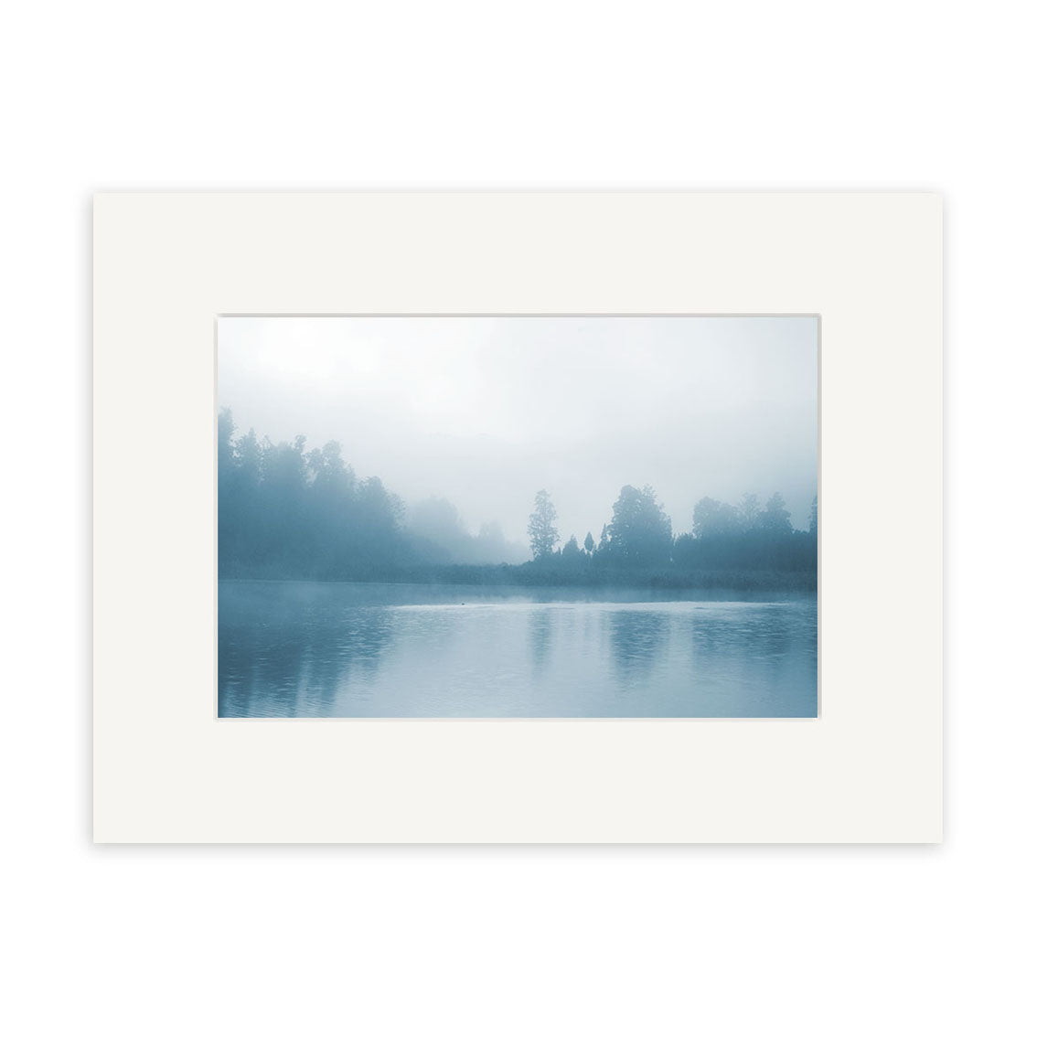 A photograph titled Misty Lake Matheson - RP186 features a misty, tree-lined lake on archival matte paper within a white mat, capturing the serene beauty of New Zealand.