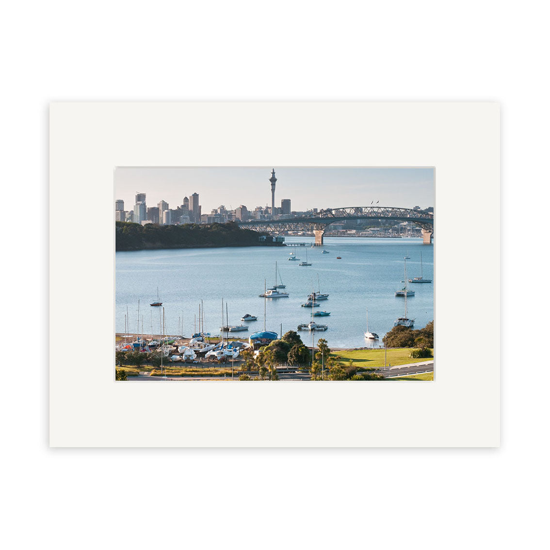 “Little Shoal Bay - RP229 captures New Zealand’s harbor with anchored sailboats, a bridge, city buildings, and a landmark tower—ideal for photographic prints on archival quality matte paper.”.