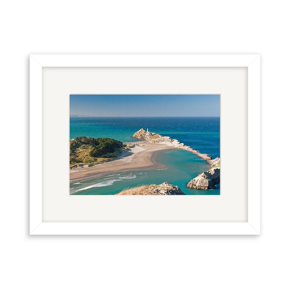 Framed photographic print Castlepoint - RP246: a New Zealand coastal landscape with a sandbar leading to an island and lighthouse, turquoise ocean, and clear sky. Printed on archival quality matte paper.