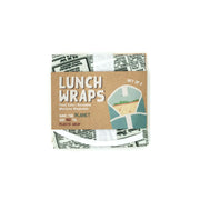The Retro Paper Lunch Wrap includes two reusable wraps with a newspaper-print design, packaged in a brown sleeve labeled Lunch Wraps. Theyre food-safe certified, machine washable, and help reduce plastic wrap use.