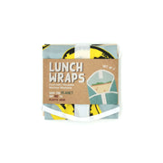 The Pop Art Banana Lunch Wrap set includes two reusable, plastic-free wraps with a stylish blue and yellow design. Folded with a brown LUNCH WRAPS label, they are food-safe, machine washable, and eco-friendly.