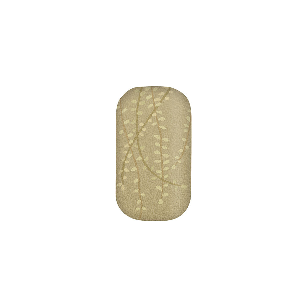 The Raw Kowhai Trinket Box is a rectangular beige organizer with rounded edges, featuring a pattern of small, light-colored leaves linked by curved lines, shown on a plain white background.