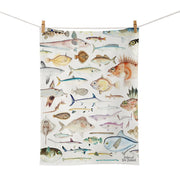 The Fishes of New Zealand Tea Towel is a cotton tea towel featuring detailed illustrations of various fish species, with Fishes of New Zealand labeled in the bottom right corner.