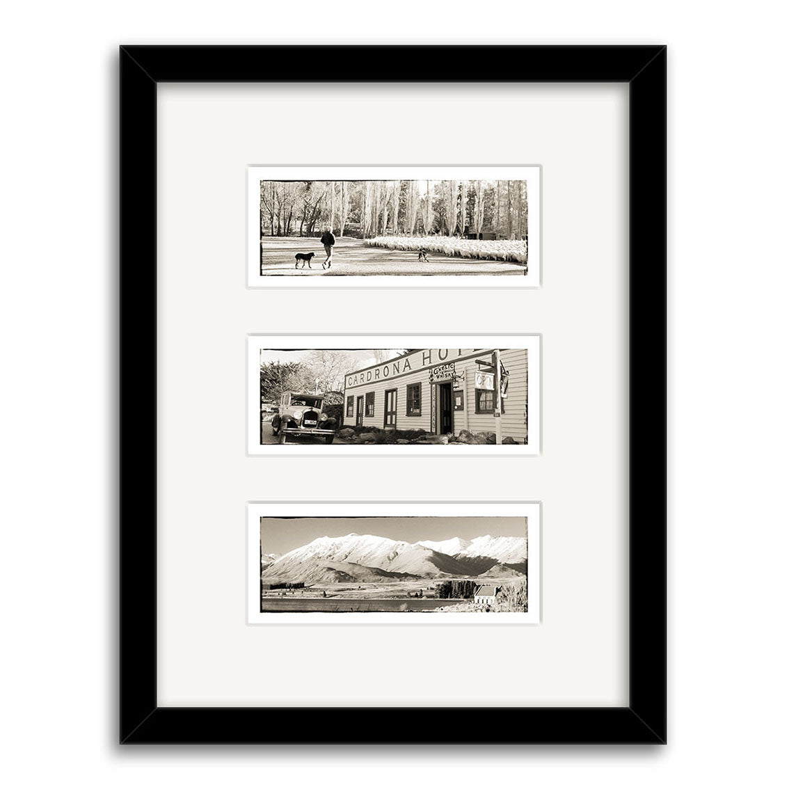 The South Island Triptych - RP044 features three black-and-white photos in a black frame: a person walking a dog, a vintage building, and a New Zealand mountain range, all printed on archival quality matte paper.