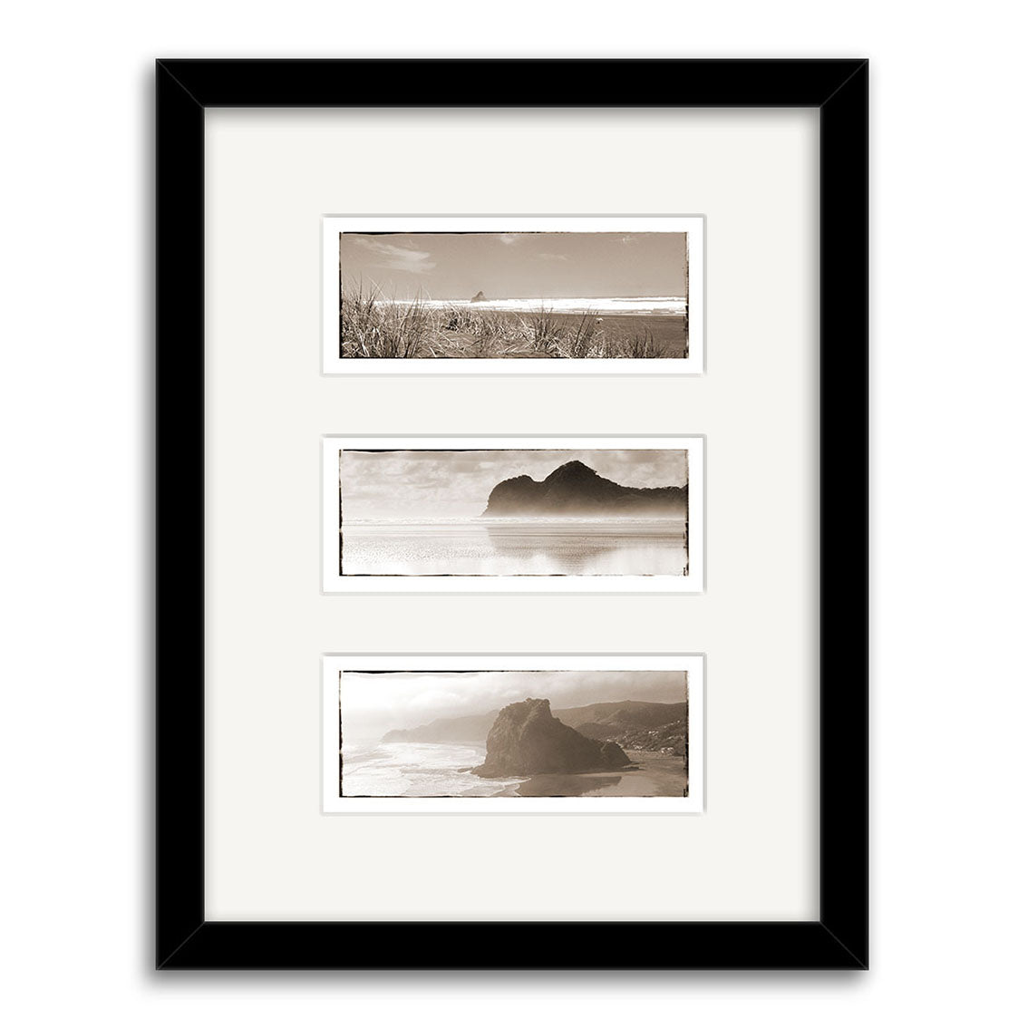 The West Coast Triptych - RP014 features three black and white New Zealand coastal prints with cliffs and ocean views, arranged vertically in a white mat and black frame on archival paper.