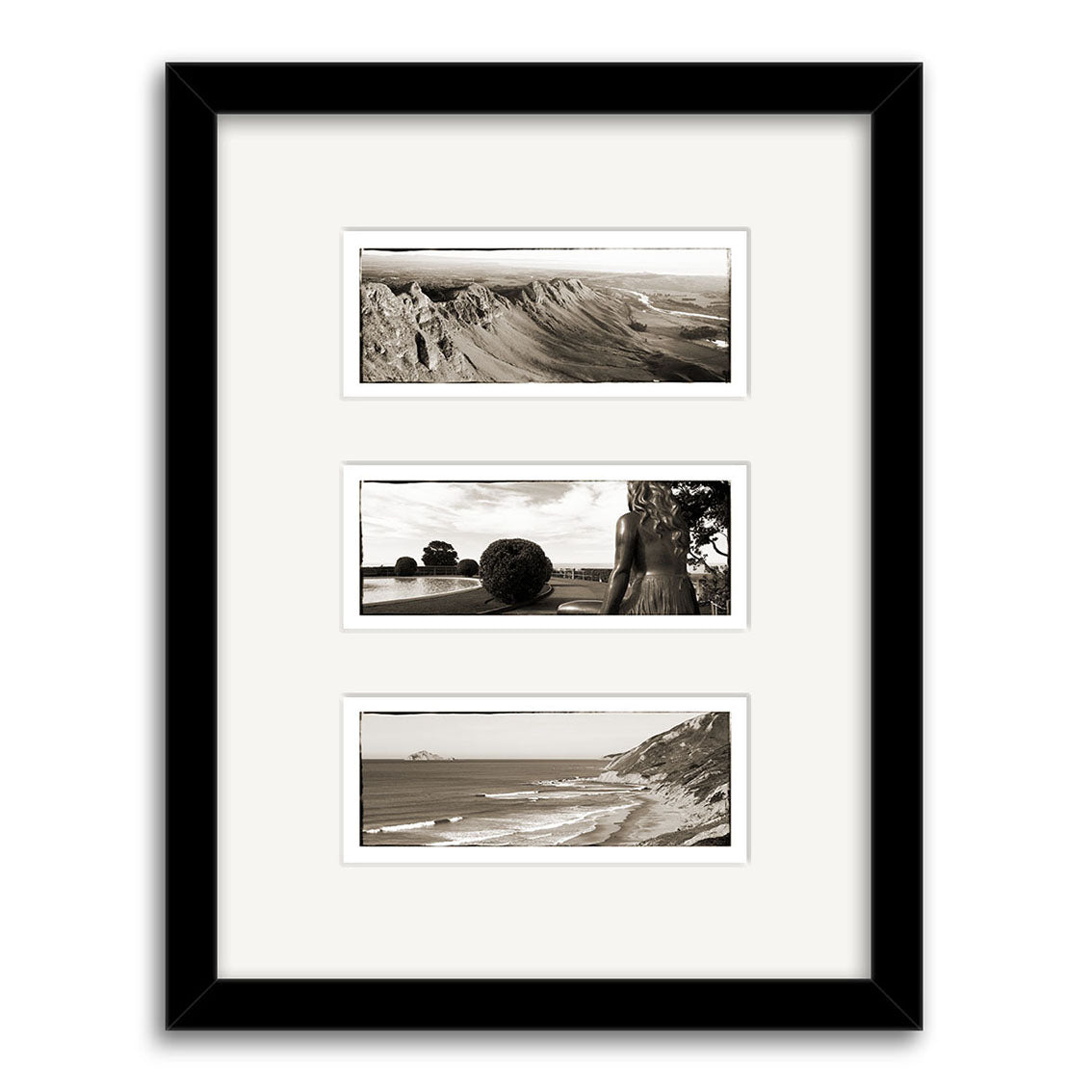 The Hawkes Bay Triptych - RP135 is a black-framed display with three horizontal black-and-white prints on archival matte paper, each centered on a white mat, depicting mountains, a tree-filled park, and New Zealands coastal shoreline.