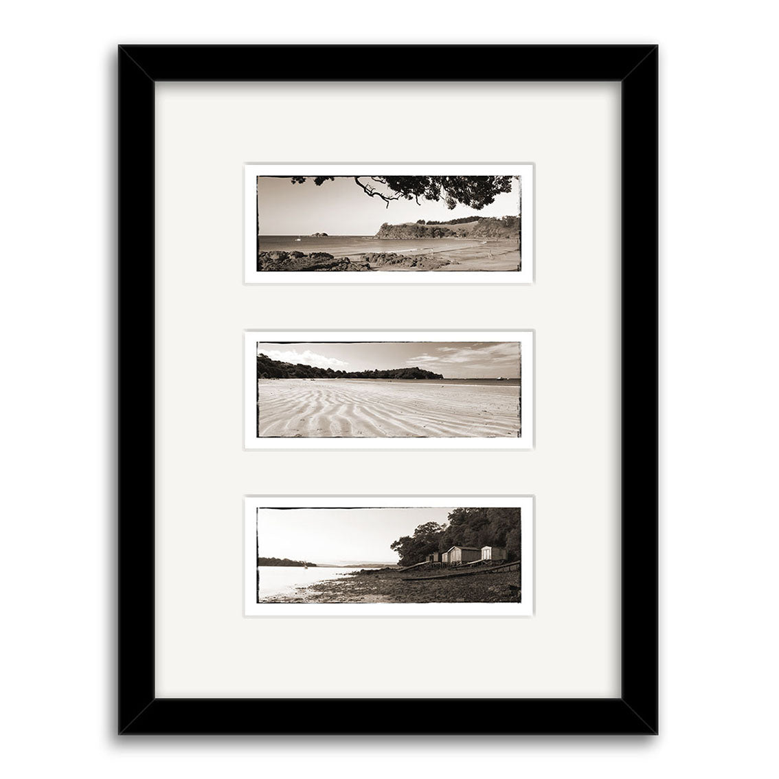The Waiheke Triptych - RP117 features a black frame with three vertically arranged black-and-white prints of New Zealand’s coastlines, showcasing water, shorelines, and trees on archival matte paper.
