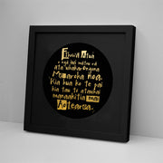 The National Anthem Foil Print features handwritten Māori text in gold foil, arranged in a black circle and shown in a sleek black frame on a white background. Available framed or unframed.