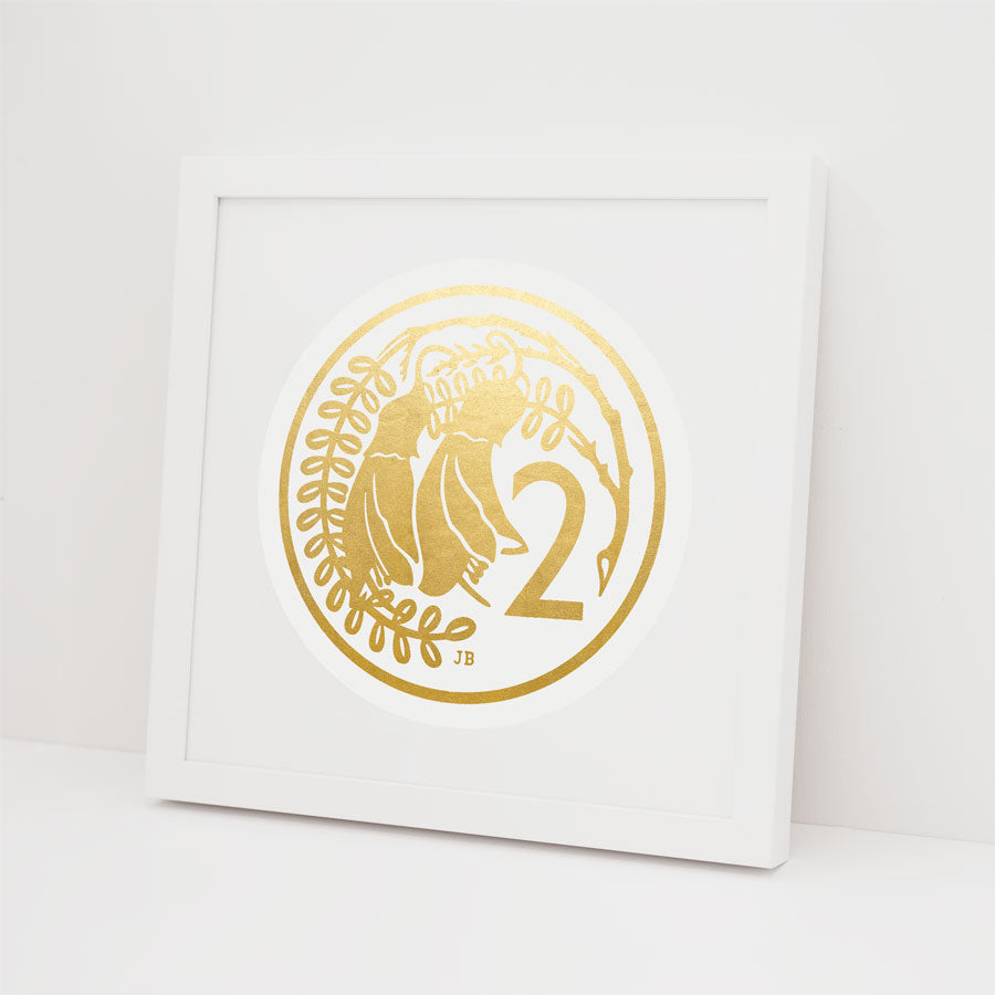 The 2 Cent Coin Foil Print features two stylized birds, branches, and the number 2 in a circle on a white background—a unique framed gold foil artwork that brings subtle Kiwiana charm to any space.