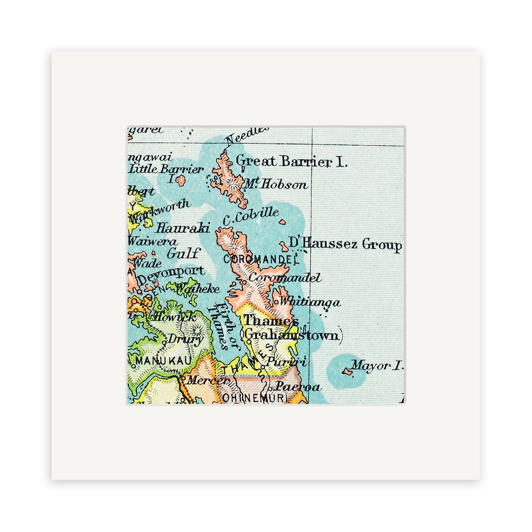 A close-up of the Coromandel Vintage Map Print displays Great Barrier Island, Thames (Grahamstown), and surrounding areas of New Zealand, elegantly presented in a white square mat frame.