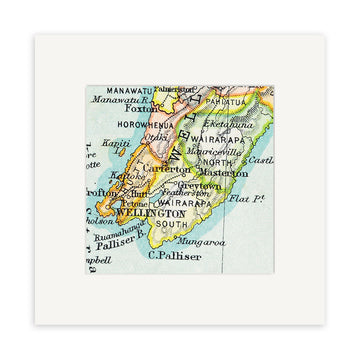 A detailed view of the Wellington Vintage Map Print—a 19th Century lithograph map of New Zealands North Island, highlighting Wellington, Manawatu, Wairarapa, and nearby towns. The giclee print comes with a white mat frame.