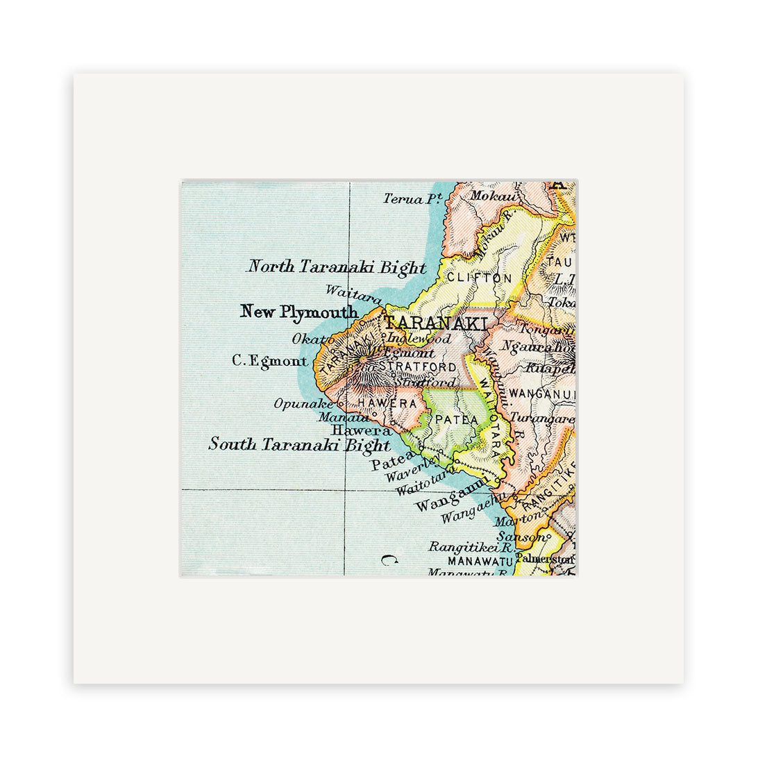 The Taranaki Vintage Map Print is a detailed lithograph showing New Zealand’s Taranaki region, with labeled towns like New Plymouth, Stratford, and Hawera, plus coastal features and intricate geography.